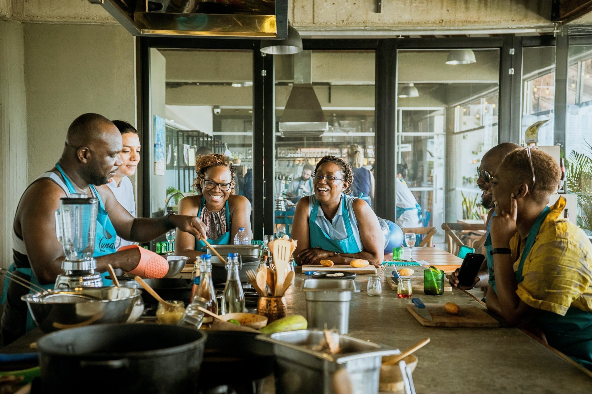 Small group sharing a culinary experience at Lunático Experience
