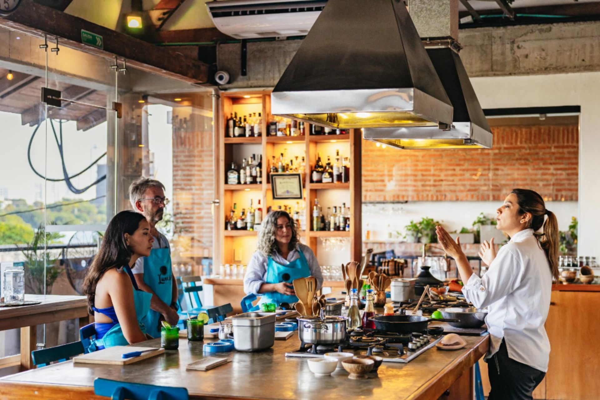 Chef guiding a Colombian cooking class at Lunático Experience in Cartagena
