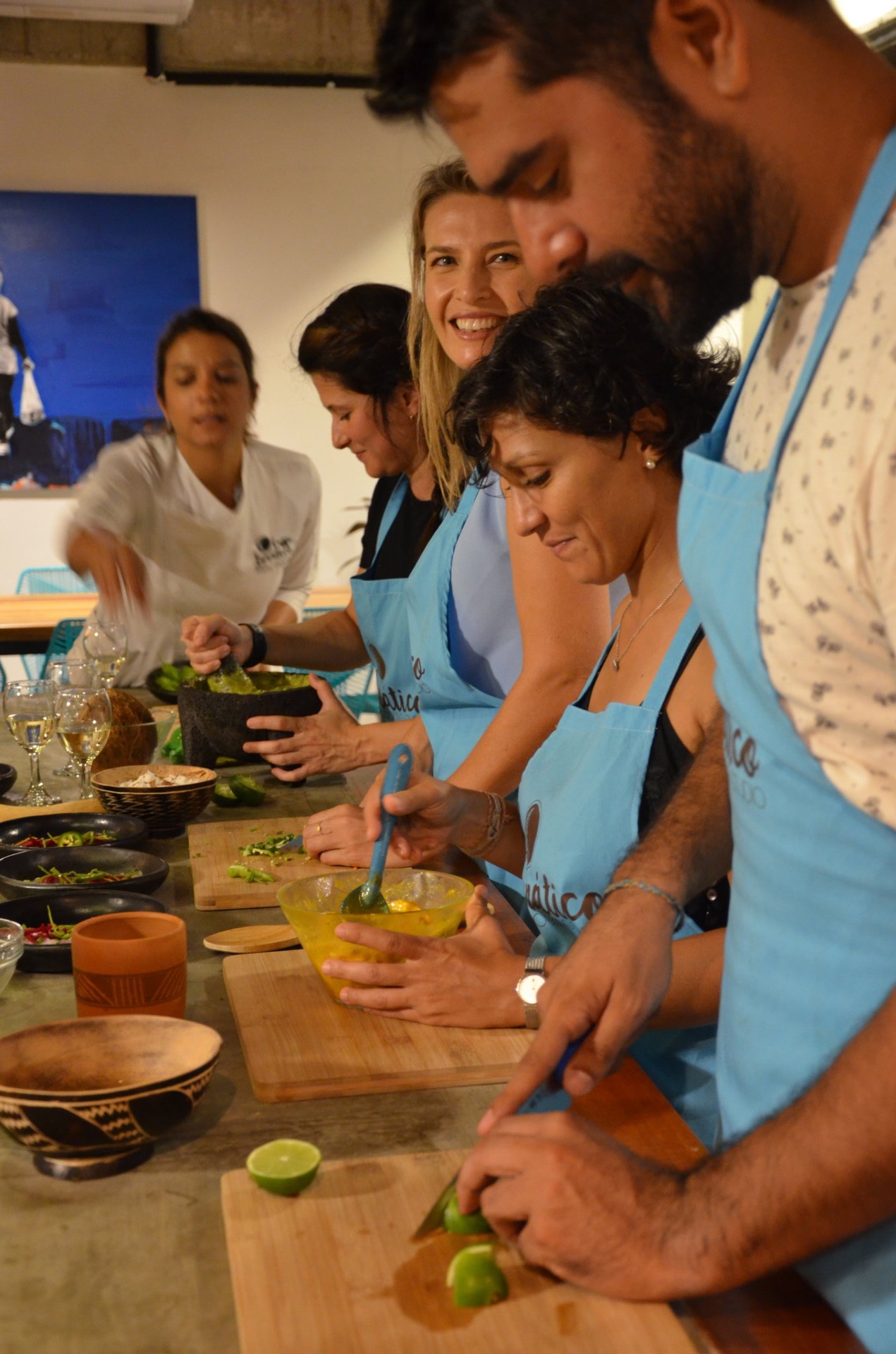 Guests preparing ceviche during a hands-on workshop at Lunático Experience